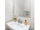 Modern half-bath with sleek sink, mirror, and neutral color scheme at 232 Parkwood Ave, Charlotte, NC 28206