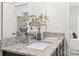 Bright bathroom featuring double vanity, granite countertops, modern fixtures, and decorative accents for a luxurious touch at 232 Parkwood Ave, Charlotte, NC 28206