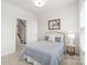 Inviting bedroom features natural light and a cozy bed near stairs, blending comfort with seamless access to other spaces at 232 Parkwood Ave, Charlotte, NC 28206