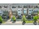 Eye-level view of townhomes with rooftop terraces, brick accents, and nicely kept landscaping at 232 Parkwood Ave, Charlotte, NC 28206