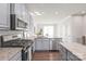 Modern kitchen with stainless steel appliances and granite countertops at 232 Parkwood Ave, Charlotte, NC 28206