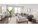 Bright living room with modern furnishings, large windows, and stylish decor at 232 Parkwood Ave, Charlotte, NC 28206