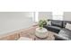 Upstairs living room featuring a large couch, large rug, and a cozy sitting area with natural light at 232 Parkwood Ave, Charlotte, NC 28206