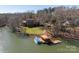 Stunning waterfront home featuring a private dock and lush landscaping at 2700 River Ridge Pl, Fort Mill, SC 29708