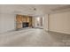 Basement with a stone fireplace and walkout access to backyard at 2700 River Ridge Pl, Fort Mill, SC 29708