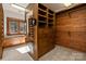Spacious walk-in closet with mirror, cabinets, and custom shelving for ample storage at 2700 River Ridge Pl, Fort Mill, SC 29708