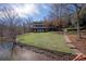 Expansive lakefront home featuring a beautiful lawn and a private shoreline at 2700 River Ridge Pl, Fort Mill, SC 29708