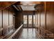 Second floor hallway with slate tile floor and lake views at 2700 River Ridge Pl, Fort Mill, SC 29708