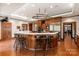 Spacious kitchen with wood cabinets, a large island, stainless steel appliances and bar stool seating at 2700 River Ridge Pl, Fort Mill, SC 29708