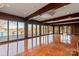 Large living room with hardwood floors, floor to ceiling windows, and views of the lake at 2700 River Ridge Pl, Fort Mill, SC 29708