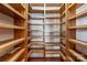 Walk-in pantry featuring floor to ceiling wood shelving for ample food and supply storage at 2700 River Ridge Pl, Fort Mill, SC 29708