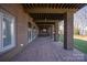 Covered patio with brick floors and access to the backyard at 2700 River Ridge Pl, Fort Mill, SC 29708