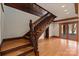 Wood staircase with a stained wood handrail and hardwood floors leading to a lower level at 2700 River Ridge Pl, Fort Mill, SC 29708