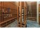 Temperature controlled wine cellar with custom wooden racks for storage at 2700 River Ridge Pl, Fort Mill, SC 29708