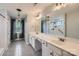 Bathroom with double vanity, decorative lighting, and walk-in tiled shower with rainfall shower head at 2864 Park Ridge Blvd, Rock Hill, SC 29732