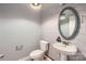 Stylish half-bathroom with wood plank accent wall, a decorative mirror, and pedestal sink at 2864 Park Ridge Blvd, Rock Hill, SC 29732