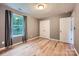 Cozy bedroom features hardwood floors, a large window, and closet at 2864 Park Ridge Blvd, Rock Hill, SC 29732
