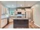Well-lit kitchen features a central island, granite countertops, stainless appliances, and white subway tile backsplash at 2864 Park Ridge Blvd, Rock Hill, SC 29732