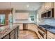 Modern kitchen with stainless steel appliances, granite countertops, and white cabinetry at 2864 Park Ridge Blvd, Rock Hill, SC 29732