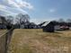 Spacious backyard with chain link fence and outbuildings at 3186 Catawba St, Claremont, NC 28610