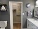 Modern bathroom featuring a vanity, toilet, and a walk-in closet at 3186 Catawba St, Claremont, NC 28610