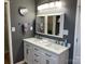 Modern bathroom with dual sinks and a vanity with dark bronze fixtures at 3186 Catawba St, Claremont, NC 28610