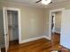 This bedroom has hardwood floors and closet with shelving at 3186 Catawba St, Claremont, NC 28610