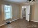 A well-lit bedroom with a view from the window and a closet for storage solutions at 3186 Catawba St, Claremont, NC 28610