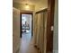 Hallway with view into dining room featuring an entrance with hanging curtain at 3186 Catawba St, Claremont, NC 28610
