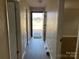 Hallway with neutral paint and decorative molding at 3186 Catawba St, Claremont, NC 28610