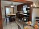 Open concept kitchen features stainless steel appliances and a view into the dining room at 3186 Catawba St, Claremont, NC 28610