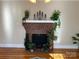 Living room features a brick fireplace with plants nearby at 3186 Catawba St, Claremont, NC 28610
