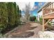 Backyard features mature trees, tasteful landscaping, and a well-maintained lawn at 319 Ohenry Ave, Davidson, NC 28036