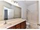 Clean bathroom featuring a single sink vanity with good storage and a shower-tub combo at 319 Ohenry Ave, Davidson, NC 28036