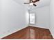 Simple bedroom with ceiling fan, hardwood floors, and a window providing light at 319 Ohenry Ave, Davidson, NC 28036