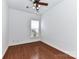 Bright bedroom with hardwood floors, ceiling fan, and a window offering lots of light at 319 Ohenry Ave, Davidson, NC 28036