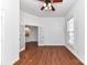 Sunlit living room featuring hardwood floors, white walls, and French doors, creating an inviting and versatile space at 319 Ohenry Ave, Davidson, NC 28036