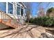 Exterior shot of a cozy stamped concrete patio accessible from the main house at 319 Ohenry Ave, Davidson, NC 28036
