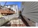 Side yard with raised garden beds, white picket fence, and mature landscaping at 319 Ohenry Ave, Davidson, NC 28036