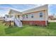 Back view featuring a staircase leading to the covered back porch at 332 Shiloh S Rd, York, SC 29745