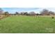 Large, well-maintained backyard, partially enclosed with fencing offering ample open space at 332 Shiloh S Rd, York, SC 29745