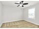 This cozy bedroom features neutral walls, plush carpeting, and a ceiling fan for added comfort at 332 Shiloh S Rd, York, SC 29745