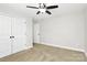 Bright bedroom with carpet, a ceiling fan, and closet offering ample storage space at 332 Shiloh S Rd, York, SC 29745