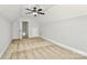 A bright bedroom with plush carpeting and a ceiling fan; has a large closet for storage at 332 Shiloh S Rd, York, SC 29745
