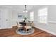 Bright dining room showcasing natural light, wainscoting, and stylish furniture at 332 Shiloh S Rd, York, SC 29745