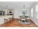 Cozy dining area featuring hardwood floors, a round table, and views into the kitchen at 332 Shiloh S Rd, York, SC 29745