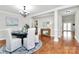The dining room is decorated with hardwood floors, white walls, and an elegant chandelier at 332 Shiloh S Rd, York, SC 29745