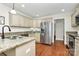Bright kitchen features stainless steel appliances, granite countertops, and custom cabinetry at 332 Shiloh S Rd, York, SC 29745