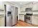 Bright kitchen features stainless steel appliances, granite countertops, and custom cabinetry at 332 Shiloh S Rd, York, SC 29745