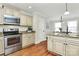 Modern kitchen features stainless steel appliances, granite countertops, and custom cabinetry at 332 Shiloh S Rd, York, SC 29745